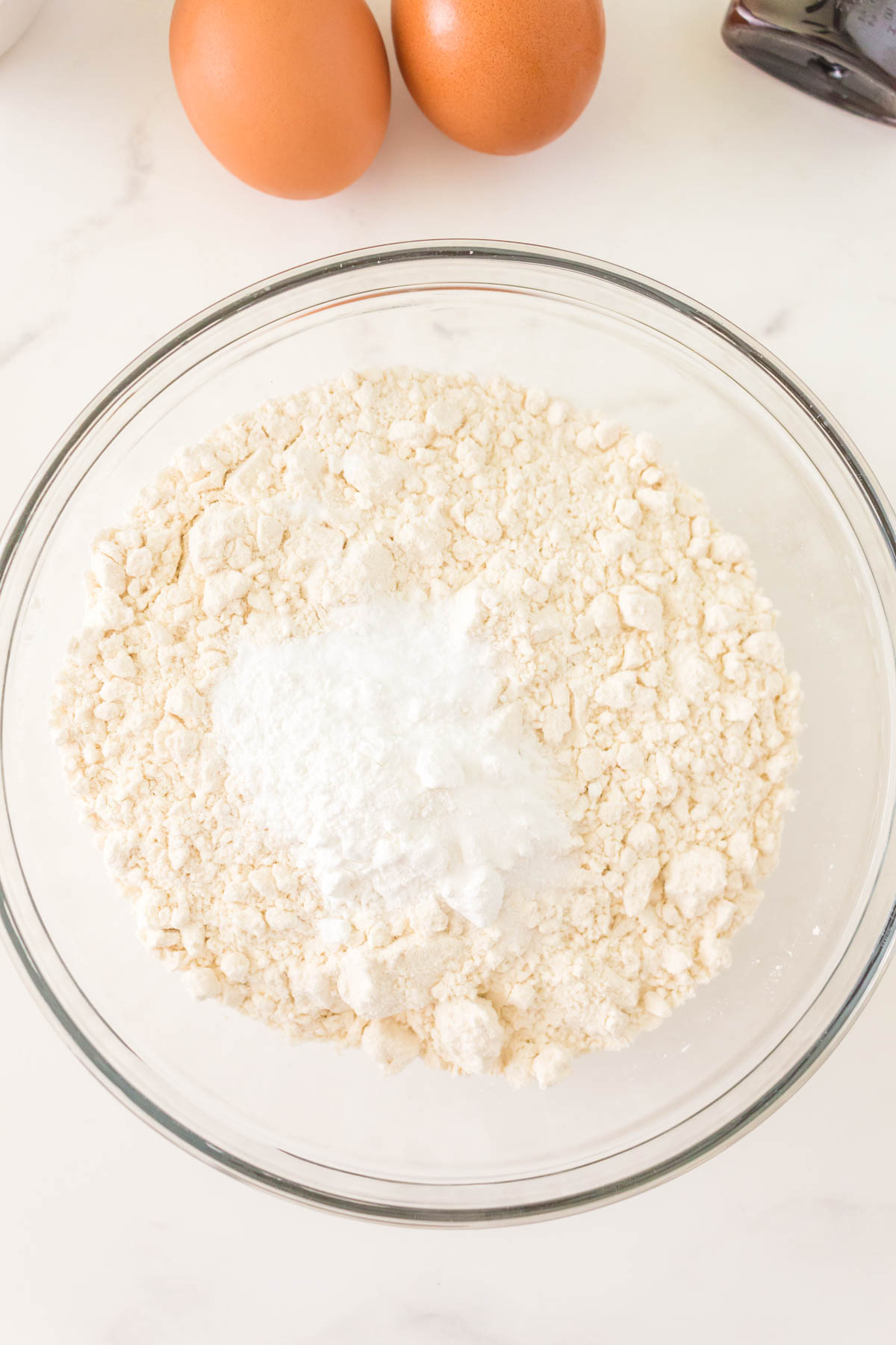 Dry ingredients used for making doughnuts in a bowl