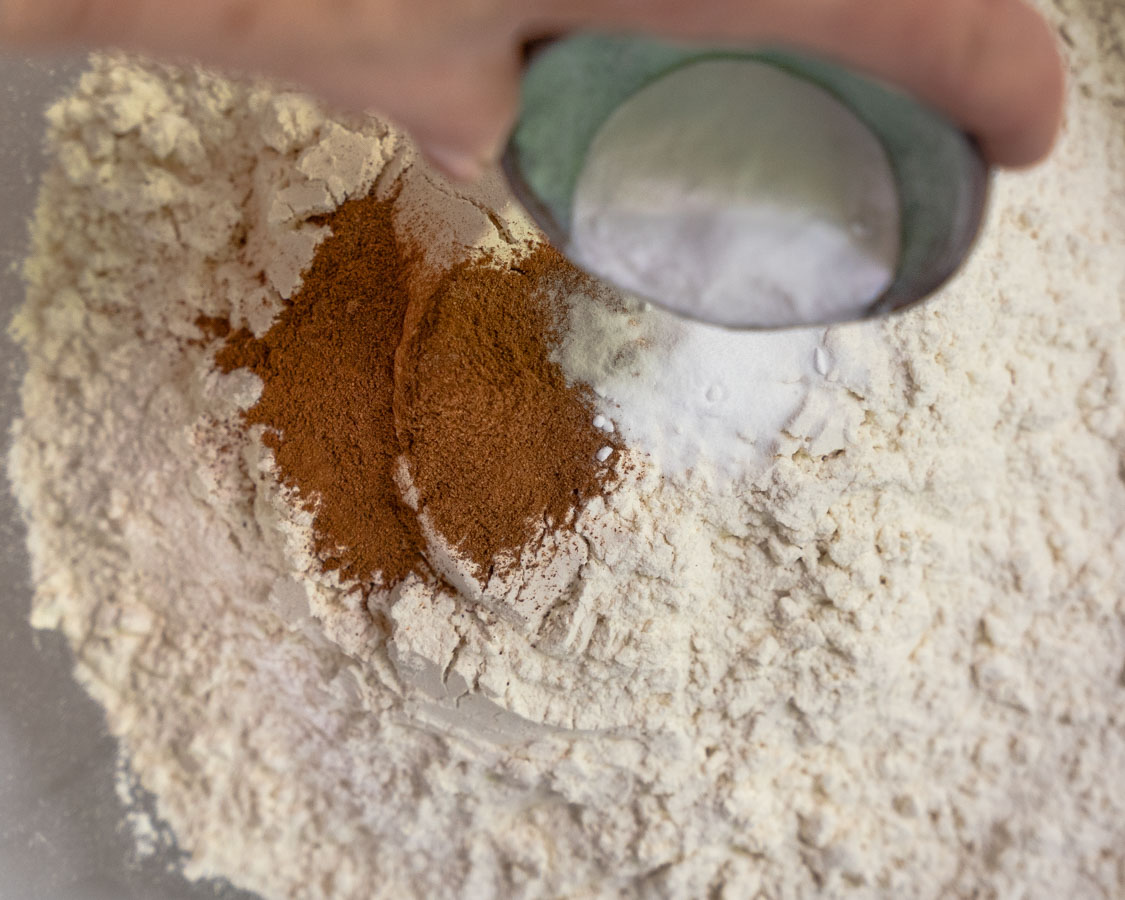Whisking flour, cinnamon, and baking soda together - Hostess At Heart