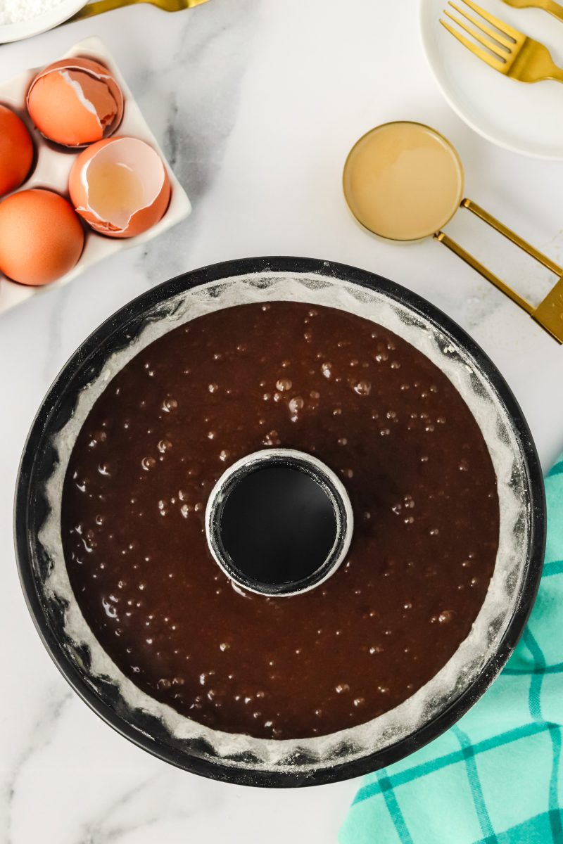 Top down view of a bundt pan filled with Guinness Stout cake batter - Hostess At Heart