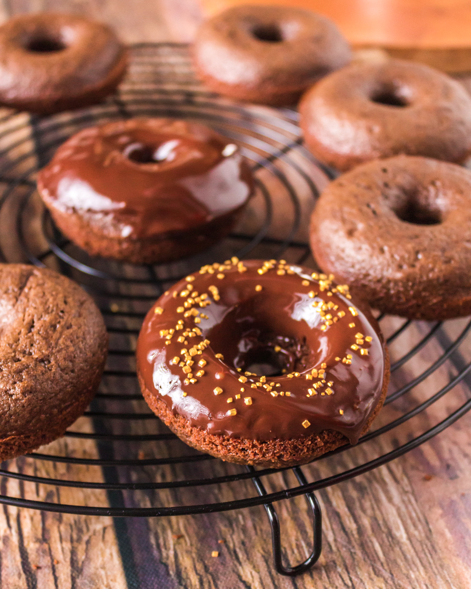 Donuts with different toppings including ganache and icing with sprinkles Hostess At Heart