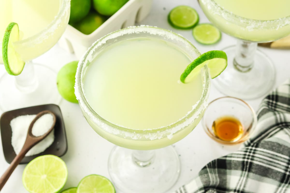 Top down view of a perfect margarita in a salt-rimmed glass - Hostess At Heart