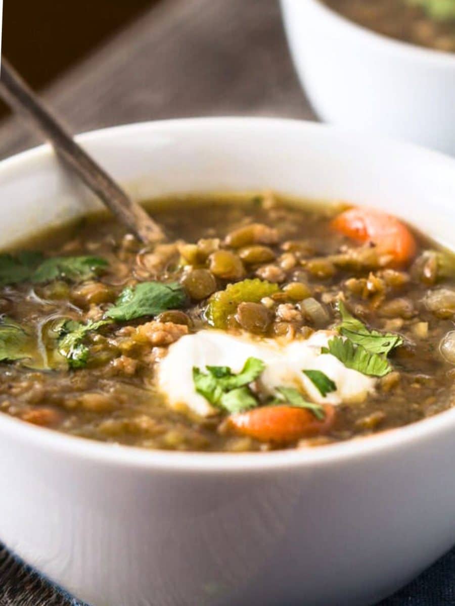 Closeup view of a bowl of Lental sausage soup and vegetables. Hostess At Heart
